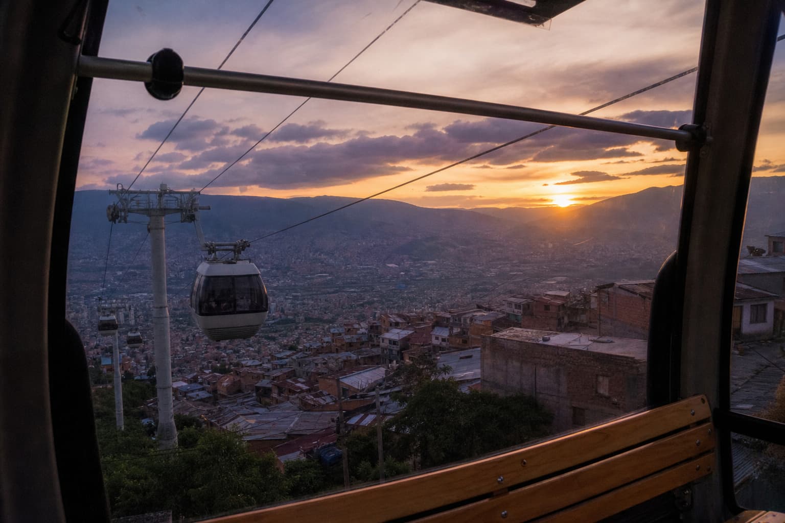 The view from a Metrocable cabin over the hillside barrios at sunset